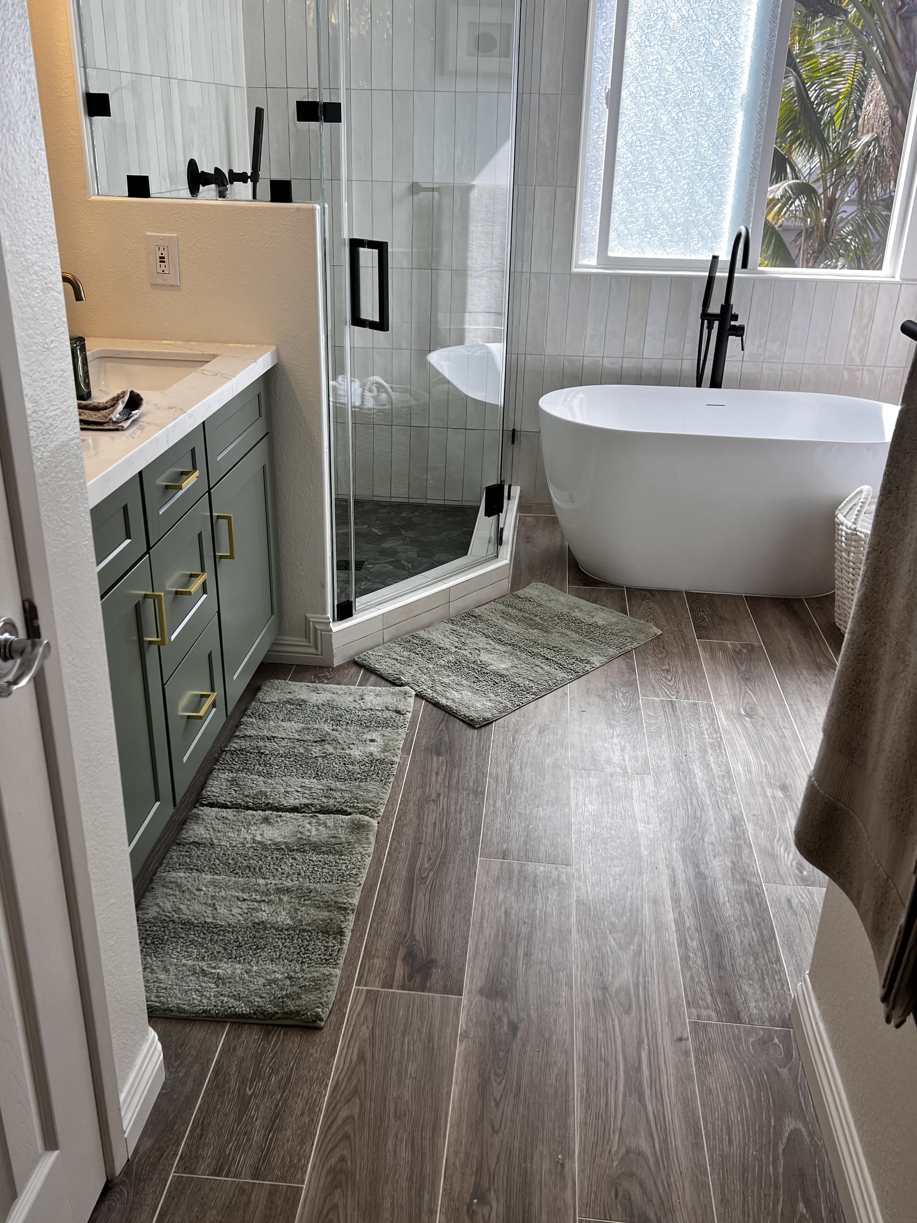 Bathroom renovation with freestanding tub and shower